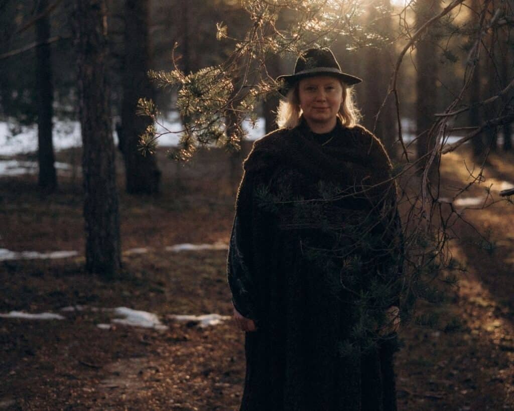 woman standing under the tree